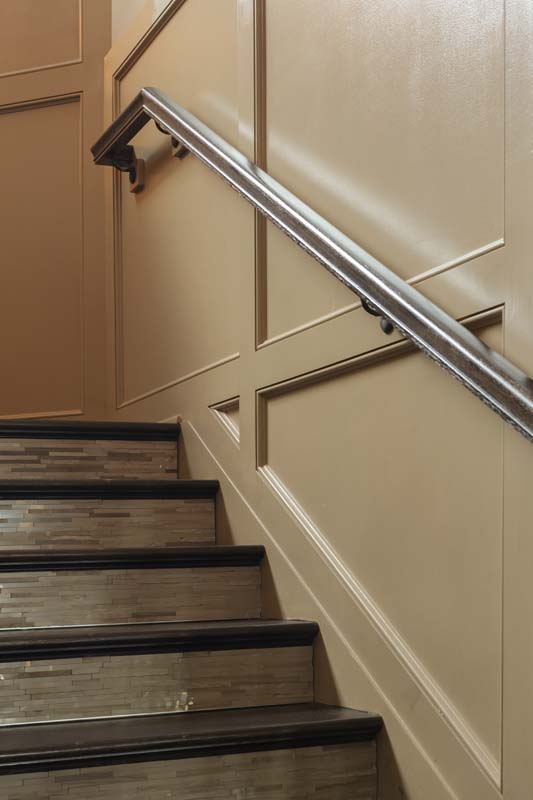 A Staircase With A Design On The Wall Next To It In Springfield Pa